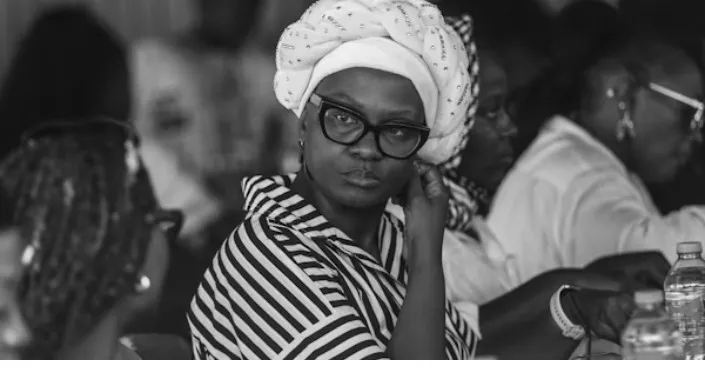 A librarian listening during a LibrariansInTech session in Abuja
