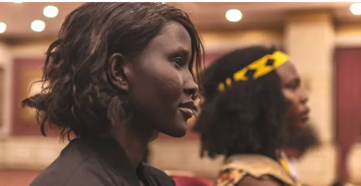 Two library professionals in conversation at a community event